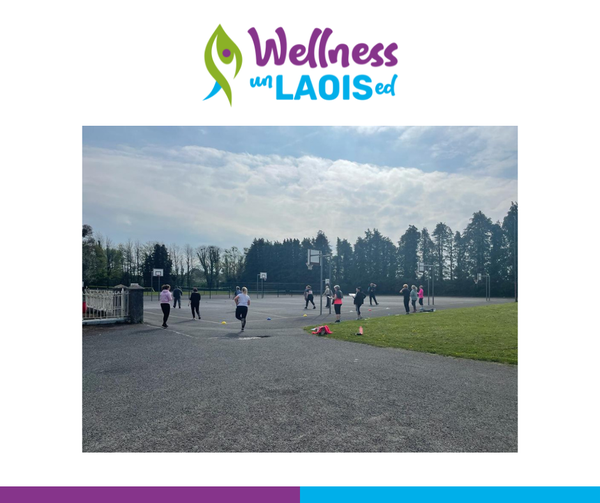 Wellness unLaoised: Pre-Testing. Group of women exercise in distance on a basketball court.